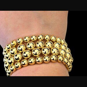 Kenneth Jay Lane Polished Gold Tone Four Row Graduated Stretch Bracelet